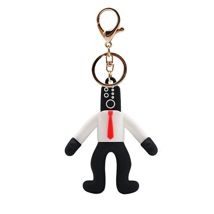 Rajzfilmfigura kulcstartó, PVC, 7x5,6 cm, fekete/fehér