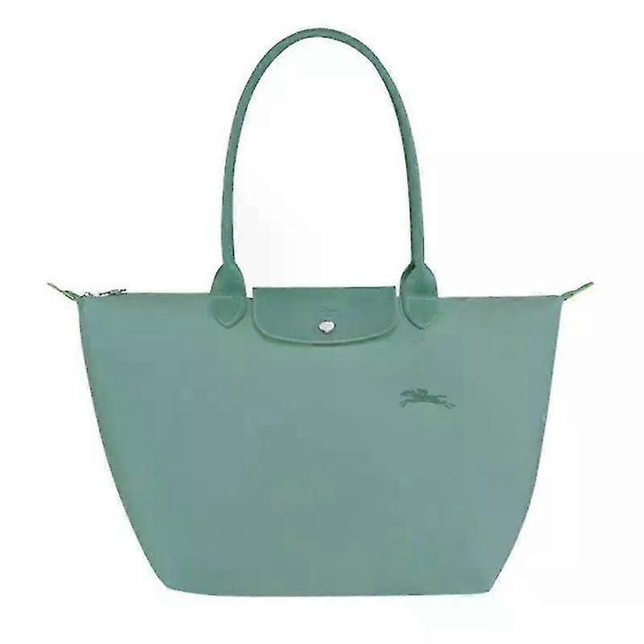 Női válltáska, dombornyomott bőrből és vízálló nejlonból, méretei a ... szerint