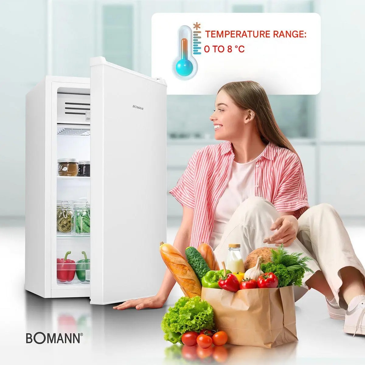 Frigider Bomann, KS7257W, H 85 cm, volum 83 litri, congelator integrat, consum redus, 2 rafturi sticla securizata, 3 compartimente usa, control temperatura, iluminat interior LED, silentios, usa reversibila, compartiment legume/fructe, suport oua, alb