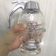 Dozator miere si sirop fara picurare – borcan tip fagure, 15×8 cm, transparent, sistem anti-scurgere