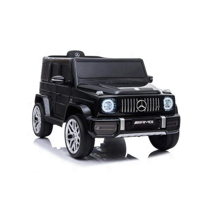 Masinuta Electrica de Tip Mercedes Benz AMG G63, Comando Kids, cu Telecomanda, Centura Siguranta, Scaun Piele Ecologica, Suspensii, Schimbator Viteze, Putere 70W, Cadru Rezistent, Sistem Iluminare, Sistem Sonor, Greutate Admisa 25 Kg, Varsta 3-6Ani, Negru